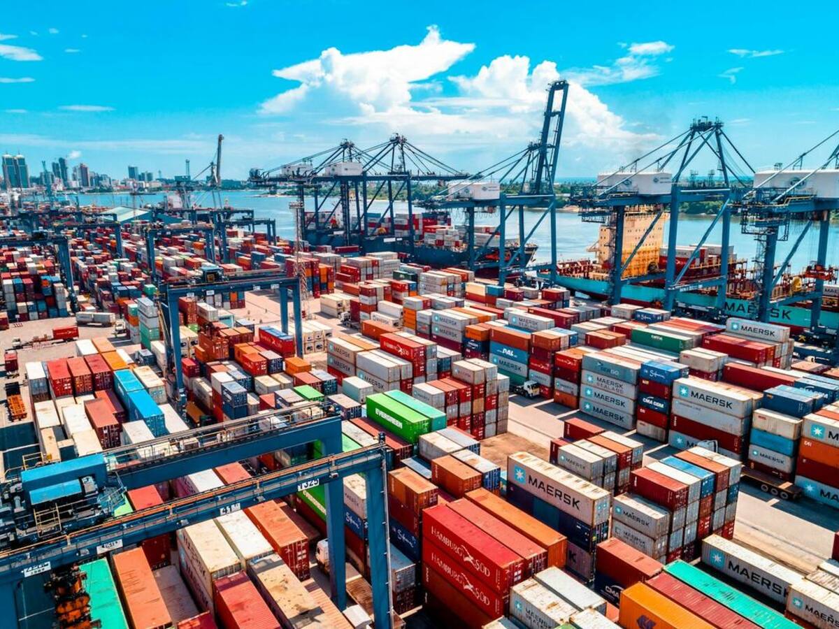 Container yard with trucks and stacked boxes