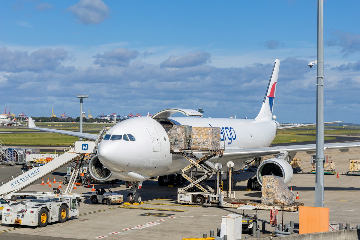 Cargo aircraft being loaded on the apron